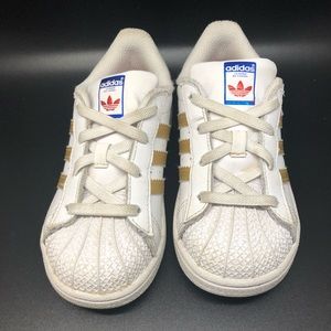 Adiadas 10k kids tennis shoes gold white